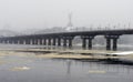 View of the Paton Bridge in winter. Snowfall in Kiev near the Dnieper River. Timelapse Royalty Free Stock Photo