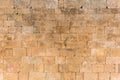 View of pattern with exterior wall texture of old building made in paired granitic stone