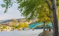 The view on the Peace Bridge with the Sololaki Hill and old town buildings on the background, Tbilisi, Georgia Royalty Free Stock Photo