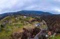 View of peaceful autumn countryside with bare trees and winding roads Royalty Free Stock Photo