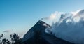 View of the peak of Acatenango volcano in Guatemala with a portion covered with clouds Royalty Free Stock Photo