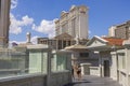 View of pedestrian bridge over Strip road  and Caesars Palace hotel on blue sky background.  Las Vegas, Nevada, Royalty Free Stock Photo