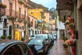 View of pedestrian street and road at Giardini Naxos town in rainy weather. Taormina, Sicily, Italy Royalty Free Stock Photo