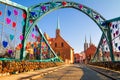 View of the pedestrian Tumski Bridge is also called Lovers Bridge, Cathedral Bridge or Green Bridge, adorned with many love lock Royalty Free Stock Photo