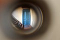 The view through the peephole at the blue door in the corridor