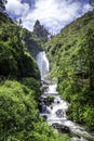 View of Peguche Waterfall in the mountains of Ecuador. Royalty Free Stock Photo