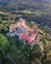 View of Pena Palace, a colorful Romanticist castle building on hilltop during a beautiful sunset, Sintra, Lisbon, Portugal. Royalty Free Stock Photo