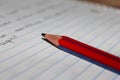 View of pencil over a notebook with writings