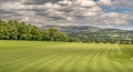 A view of Pendle Hill and gathering rain clouds.