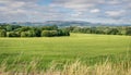 A view of Pendle Hill and gathering white clouds.