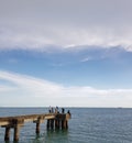 View of People With Background of The Sea, Clouds and Blue Sky at Meulaboh Harbor.