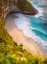 View of a people couple on the beach on Bali, Indonesia. Vacation and adventure. Beach and turquoise water. Top view from drone at Royalty Free Stock Photo