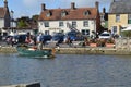 View of people enjoying the sunny day at the River Frome in Dodington Park Royalty Free Stock Photo