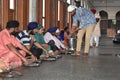 View of people in golden temple amritsar while eating food called langar in local language