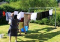 View of people hanging laundry on clothesline in backyard