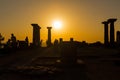 View of people and historical ruins at sunset captured in the temple of Athena at the ancient city of Assos located in Behramkale