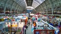 a view of people inside a convention center filled with lots of different kinds of merchandise Royalty Free Stock Photo