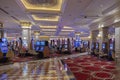 View of people playing in Venetian hotel casino on slot machines. Royalty Free Stock Photo