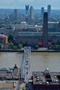 View of People Walking around Millennium Bridge