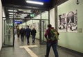 View of people walking through a corridor toward the escalators of the subway station in Frankfurt