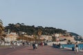 View of people walking on The Promenade des Anglais in Nice, France, on a sunny spring day