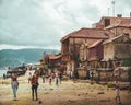 View of people walking on the sand in Combarro town, Galicia, Spain