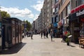 View of people walking on sidewalk by one of the main avenues called Halaskargazi in Sisli district of Istanbul.