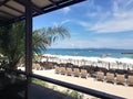 View a perfect white sand beach with line of sun beds in Pattaya Thailand, aquamarine ocean and blue sky on background Royalty Free Stock Photo