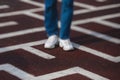 View of a person feet legs trapped and trying to find escape and exit from maze labyrinth, concept of finding solution to problem Royalty Free Stock Photo