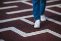 View of a person feet legs trapped and trying to find escape and exit from maze labyrinth, concept of finding solution to problem Royalty Free Stock Photo