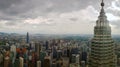 The view of a petronus tower from another tower with kuala lampur city scape horizon in the background