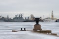 View from the Petrovsky pier to the parking lot of the warships of the Baltic Navy on a gloomy January day. Kronstadt