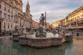 View of Piazza Navona with the famous four rivers fountain at sunset