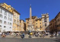 A view of the Piazza Rotunda with a fountain and obelisk of Ramses II and numerous tourists, Rome,