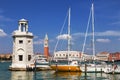 View of the Piazza San Marco, the lighthouse at the island of San Giorgio Maggiore and yachts at berth. Venice