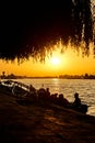 View of a pictoresque canal in the Danube Delta with silhouettes at sunset, Romania