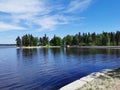 View of the picturesque shore of the Vyborg Bay with beautiful bridges in the Monrepos Park of the city of Vyborg against the Royalty Free Stock Photo