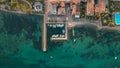 View of the picturesque turquoise waters of Cisano Harbour in Bardolino, Italy