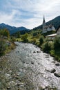 View of the picturesque village and church of Savognin on the Julia River in the Swiss Alps