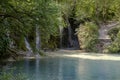 View of a picturesque waterfall and a small lake Royalty Free Stock Photo