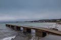 View of a pier in Izola below Bellevedere viewpoint on the north of Adriatic coast. Cloudy weather and long pier. Izola in the Royalty Free Stock Photo