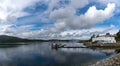 View of the pier and marina and historic Lochalsh Hotel in Kyle of Lochalsh in the Scottish Highlands