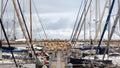 View on pier with moored yachts and stone breakwater Royalty Free Stock Photo