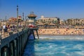 View of the pier, ocean and beach in surf city Huntington Beach, famous tourist destination in California