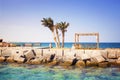 View of a pier with palm trees