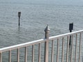 a view of the pier of the sea with a iron fence Royalty Free Stock Photo