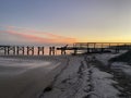 View of the pier at sunset. Biloxi Beach, Mississippi. Royalty Free Stock Photo