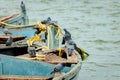 View of pigeons sitting on old rusty boats