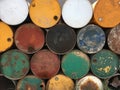 View of pile of empty big rusty fuel metal barrels outdoors near