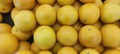 View of pile of oranges being sold in market place, top view of sunkist oranges, yellow round fruits, fresh fruit background Royalty Free Stock Photo